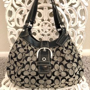 Authentic Coach purse covered in the “C” emblem.